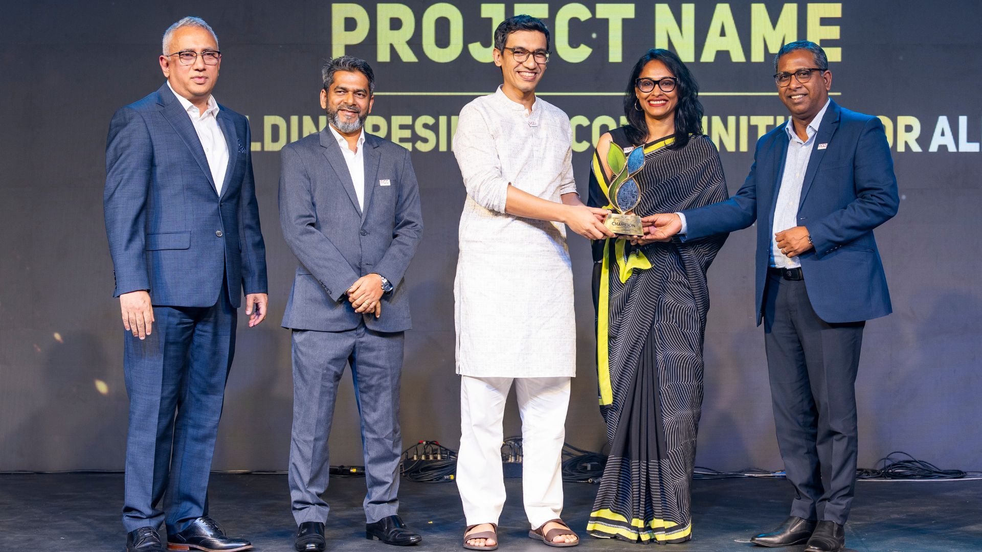 Shamima Akhter and Ruhul Quddus Khan accepting the award on stage