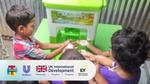 Children using a Happy Tap hand hygiene station