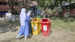 Students using tri-coloured bins